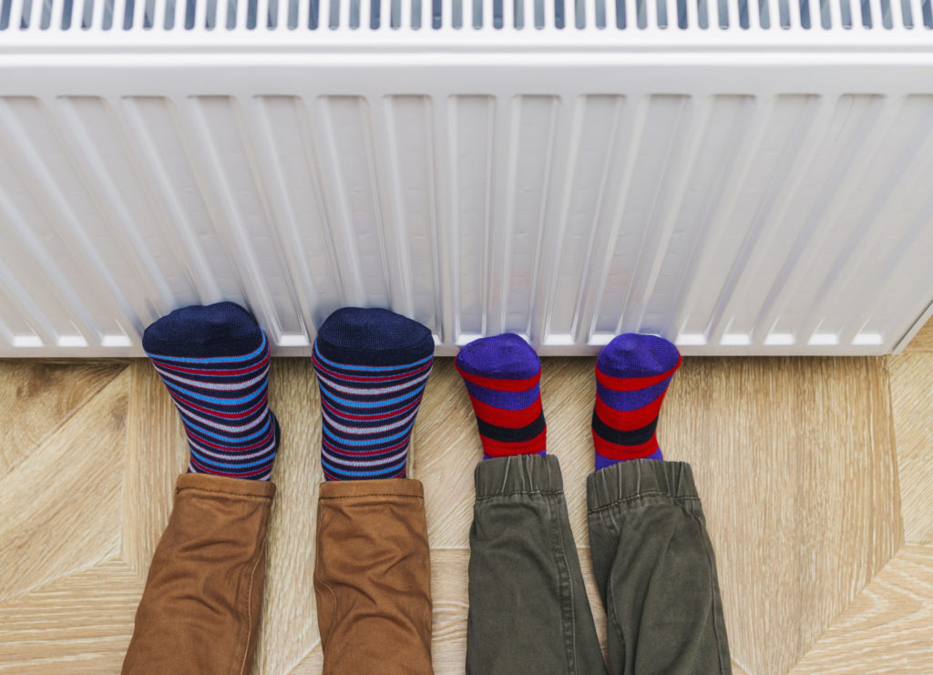 Warming feet on a radiator